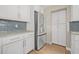 Contemporary kitchen design with stainless steel refrigerator and ample storage at 352 La Hacienda Dr, Indian Rocks Beach, FL 33785