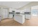 Well-equipped kitchen with a center island, stainless appliances, and ample cabinet space at 352 La Hacienda Dr, Indian Rocks Beach, FL 33785