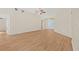 Bright living room with light wood floors, neutral walls, and a ceiling fan at 352 La Hacienda Dr, Indian Rocks Beach, FL 33785
