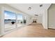 Bright living room with water view from sliding glass doors and a fireplace at 352 La Hacienda Dr, Indian Rocks Beach, FL 33785