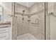 This bathroom features a tiled shower with a glass door and two tiled corner shelves at 352 La Hacienda Dr, Indian Rocks Beach, FL 33785