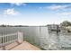 Beautiful view of the waterfront showcasing the dock and boats, perfect for water enthusiasts at 352 La Hacienda Dr, Indian Rocks Beach, FL 33785
