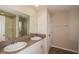 Bathroom with double vanity and a large mirror at 37147 Sagemoor Dr, Zephyrhills, FL 33541