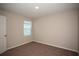 Bedroom with window, carpet, and neutral colored walls at 37147 Sagemoor Dr, Zephyrhills, FL 33541