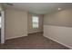 Second floor loft area featuring neutral color palette and carpet at 37147 Sagemoor Dr, Zephyrhills, FL 33541