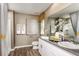 Well-lit bathroom with double sink vanity, ample counter space, and modern fixtures at 37206 Sagemoor Dr, Zephyrhills, FL 33541