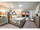 Serene main bedroom suite with decorative headboard wall, soft lighting, and sunset view at 37206 Sagemoor Dr, Zephyrhills, FL 33541