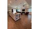 Bright, open-concept living space with recessed lighting, an island, and an adjacent Gathering room at 3895 Tate Ct, North Port, FL 34288
