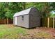 The storage shed features a metal roof, double doors, and a separate entrance at 3906 W Rogers Ave, Tampa, FL 33611