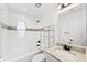 The bathroom features subway tiles in the shower, granite counters and black fixtures at 3906 W Rogers Ave, Tampa, FL 33611