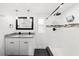 Bathroom features double sinks, modern fixtures, and a walk-in shower with glass door at 3906 W Rogers Ave, Tampa, FL 33611