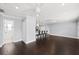 Spacious living area showcasing an open layout with access to the kitchen and bathroom at 3906 W Rogers Ave, Tampa, FL 33611