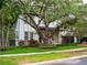 Charming home with lush landscaping, mature trees, and a well-manicured lawn at 4313 W Vasconia St, Tampa, FL 33629