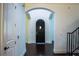 Inviting foyer showcasing dark hardwood floors, arched doorways, and elegant architectural details at 4313 W Vasconia St, Tampa, FL 33629