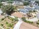 This aerial view highlights the home's backyard, showcasing lush greenery, mature trees, and a fenced perimeter at 4514 Arizona Sun Ct, Valrico, FL 33594
