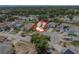 Overhead view of multiple houses on a quiet cul-de-sac and surrounded by mature trees at 4514 Arizona Sun Ct, Valrico, FL 33594