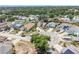 Beautiful aerial view of homes on a cul-de-sac surrounded by lush green landscaping and mature trees at 4514 Arizona Sun Ct, Valrico, FL 33594