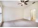 Bedroom featuring neutral carpet, ceiling fan, and a view from the window at 4514 Arizona Sun Ct, Valrico, FL 33594