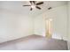 Bright bedroom with carpet, ceiling fan, and a view of the doorway at 4514 Arizona Sun Ct, Valrico, FL 33594