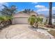 Single story home featuring a two car garage, walkway and palm trees at 4514 Arizona Sun Ct, Valrico, FL 33594