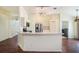 Bright kitchen with stainless steel appliances, breakfast bar, and hardwood floors at 4514 Arizona Sun Ct, Valrico, FL 33594