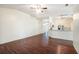 Bright living room with wood floors and open layout to the kitchen area at 4514 Arizona Sun Ct, Valrico, FL 33594