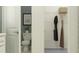 Bathroom doorway view into closet space, with hanging rack; practical layout designed for seamless transitions and efficient organization at 4752 Southern Valley Loop, Brooksville, FL 34601