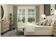 Bright bedroom with large windows, stylish furniture, and soothing color palette at 4752 Southern Valley Loop, Brooksville, FL 34601