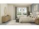 Cozy bedroom featuring a large window, dresser, neutral rug, and inviting bed; perfect blend of comfort and style for restful nights at 4752 Southern Valley Loop, Brooksville, FL 34601
