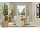 Elegant dining area featuring a light wood table, modern chairs, and stylish decor at 4752 Southern Valley Loop, Brooksville, FL 34601