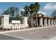 Community entrance with brick columns, a decorative gate, and manicured landscaping at 4752 Southern Valley Loop, Brooksville, FL 34601