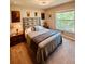 Cozy bedroom features natural light, a comfortable bed, and a peaceful ambiance at 5103 98Th E Ave, Parrish, FL 34219