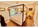 Stylish bedroom offers a four-poster bed, ample light, and relaxing decor at 5103 98Th E Ave, Parrish, FL 34219