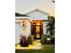 Inviting home exterior featuring a well-lit entryway, manicured lawn and landscape, and a welcoming ambiance at 5103 98Th E Ave, Parrish, FL 34219