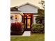Charming front door with stained glass, surrounded by vibrant landscaping and an inviting walkway at 5103 98Th E Ave, Parrish, FL 34219