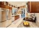 Charming kitchen boasts stainless appliances, beautiful countertops, and a delightful view into other rooms at 5103 98Th E Ave, Parrish, FL 34219