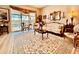 Cozy living room with comfortable seating, a patterned rug, and a view to the lanai area at 5103 98Th E Ave, Parrish, FL 34219