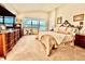 Elegant main bedroom with ample light, stylish decor, and a relaxing atmosphere at 5103 98Th E Ave, Parrish, FL 34219