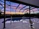 Enclosed pool area with clear chairs featuring a stunning sunset view at 5103 98Th E Ave, Parrish, FL 34219