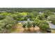 The property is surrounded by mature trees, providing a private setting, with a spacious yard at 603 Amana Ave, Brandon, FL 33510