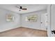 Bright bedroom with wood-look flooring, natural light, and neutral walls, creating a relaxing retreat at 603 Amana Ave, Brandon, FL 33510