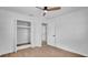 Bright bedroom featuring wood-look floors and ample closet space, offering a serene and organized living area at 603 Amana Ave, Brandon, FL 33510
