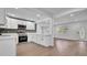 Open concept living area, modern kitchen, lots of counter space, and neutral flooring throughout at 603 Amana Ave, Brandon, FL 33510