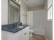 Contemporary bathroom with a white vanity, blue countertop, and a bathtub with subway tile surround at 6109 Marsh Trail Dr, Odessa, FL 33556