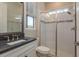 Modern bathroom features a glass-enclosed shower with decorative tile and sleek fixtures at 6109 Marsh Trail Dr, Odessa, FL 33556