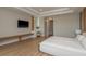 This comfortable bedroom boasts modern design, a tray ceiling, a makeup vanity, and expansive windows at 6109 Marsh Trail Dr, Odessa, FL 33556