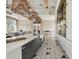 Well-appointed clubhouse kitchen offers a large island, ample counter space, and seating for casual dining at 6109 Marsh Trail Dr, Odessa, FL 33556