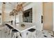Spacious clubhouse kitchen with bar seating, and a wall-mounted television at 6109 Marsh Trail Dr, Odessa, FL 33556