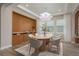 Elegant dining room featuring modern chandelier, wood floors, and built-in cabinetry at 6109 Marsh Trail Dr, Odessa, FL 33556