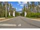 Community entrance showing Tarrarmore signage with manicured landscaping leading into the neighborhood at 6109 Marsh Trail Dr, Odessa, FL 33556